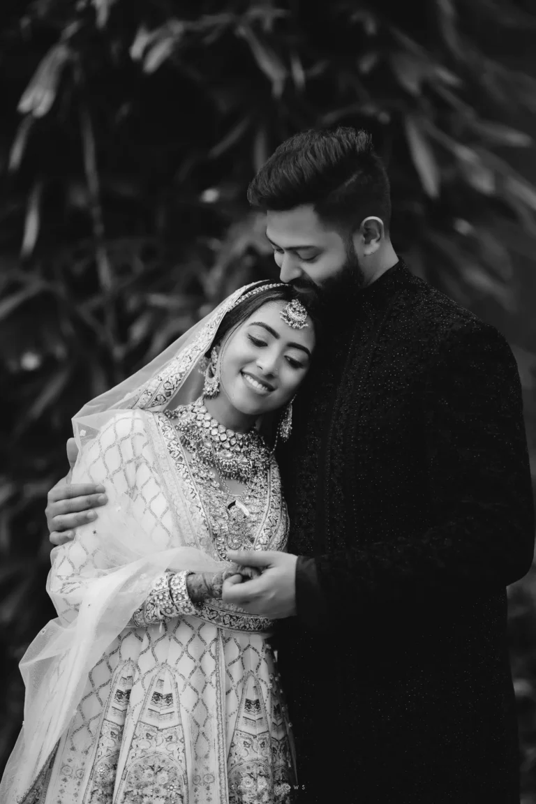 Bride and groom posing together outdoors
