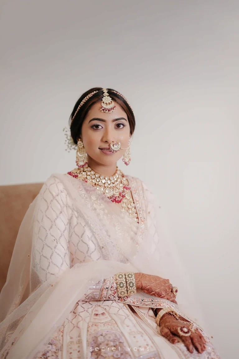 Bride in wedding dress smiling during solo photo session