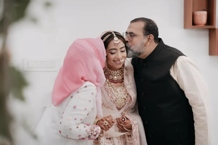 Bride sharing an emotional moment with her parents before the wedding