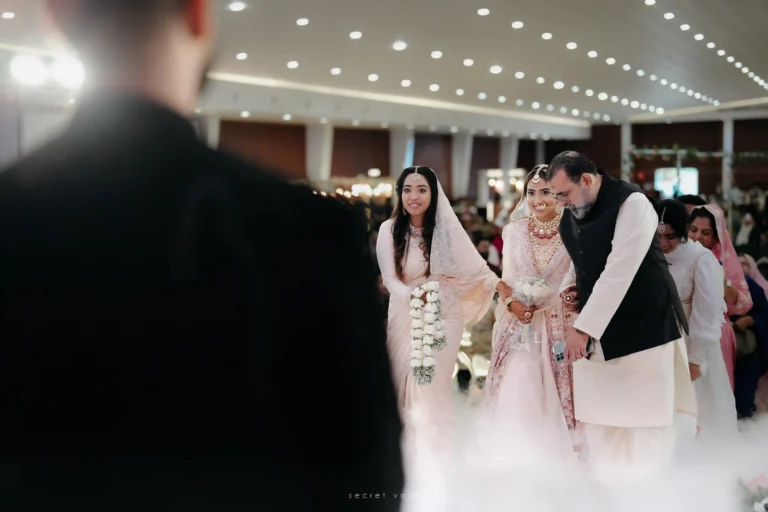 Bride’s grand entry with parents during a Kerala temple wedding