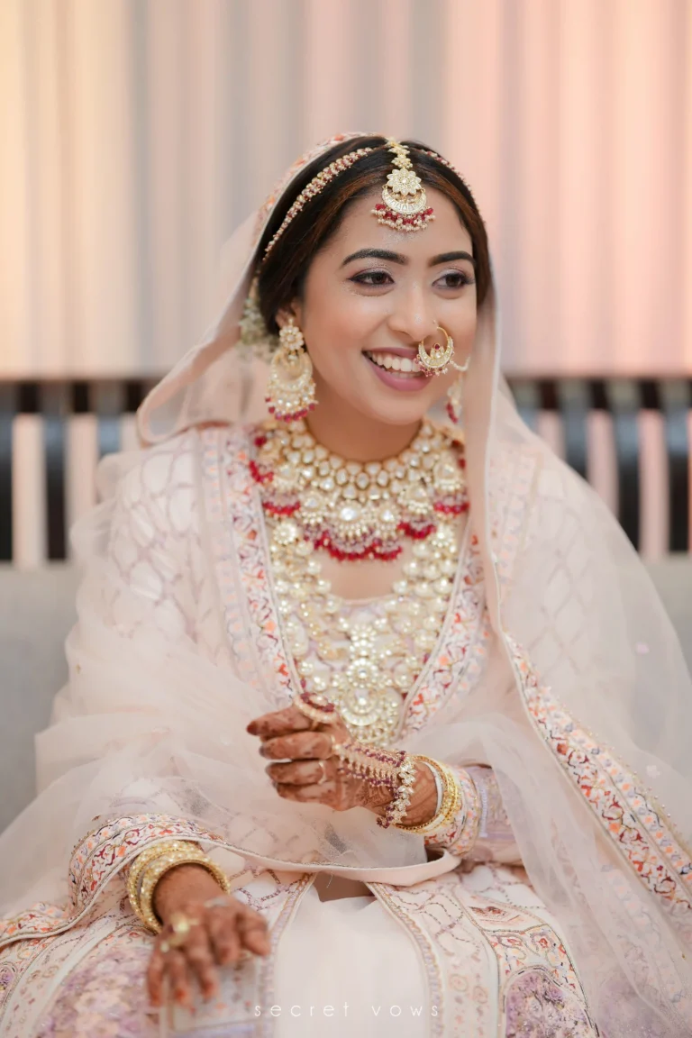 Candid bridal portrait in flowing gown with natural light background