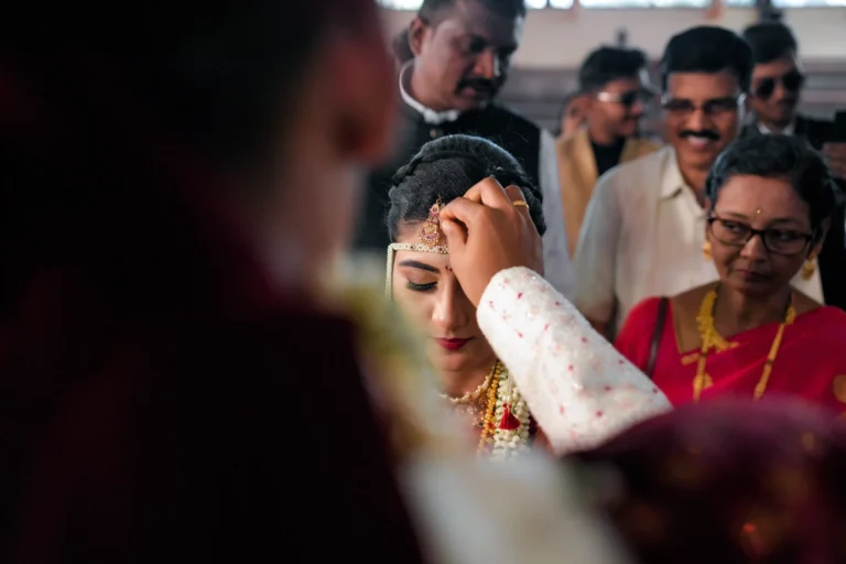 Indian wedding ritual – groom touches bride’s forehead with sindooram